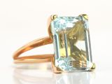 an image of a ring with a blue topaz stone