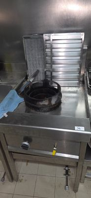 stainless steel counter top with a frying pan on top of it