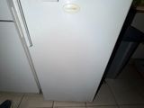 a white refrigerator with a number on it in a kitchen