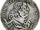 une pièce en argent avec l'image d'un homme de profil