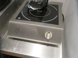 a stove with a pot on top of it in a kitchen