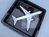 a model of an airplane on a tray on a table