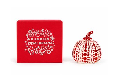 a red box with a small white pumpkin next to it