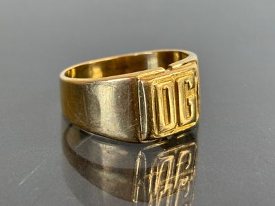 an image of a gold ring with the word boo on it