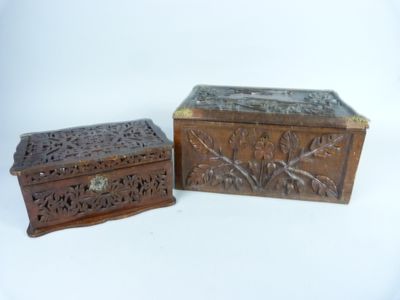 two wooden boxes sitting next to each other on a white surface