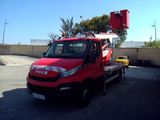 a red truck with a crane on the back of it