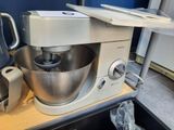 a mixer sitting on a counter in a kitchen