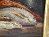 une photo d'un tableau représentant des poissons posés sur une table