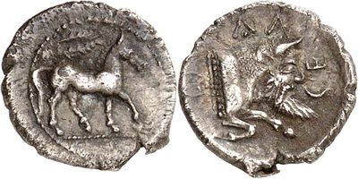 a close up of a coin with a bull on it