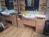 a bathroom with two sinks and a mirror on the wall