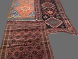 three rugs with different colors and patterns on them