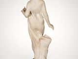 an image of a statue of a woman holding a book