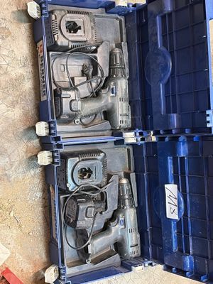 two tools in a blue case sitting on the floor