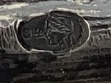a black and white photo of a shoe on the beach