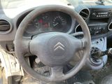 dashboard of a car with a steering wheel and dashboard gauges