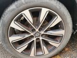 a tire on the side of a car with a flat tire