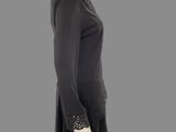 an image of a mannequin wearing a black dress and a hat