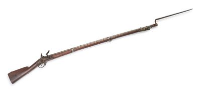 a rifle with a wooden barrel and a metal handle