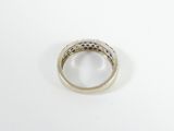 a close up of a diamond ring on a white surface