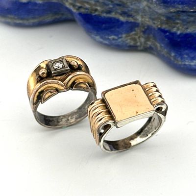 pair of gold and silver rings with a square stone in the middle