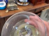 a person holding a wine glass in their hand