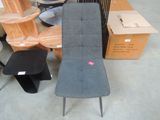 a chair that is sitting next to a table