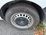 a close up of a tire on the side of a car