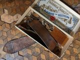 a box that has a knife in it on the floor