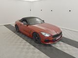 an image of a red sports car parked in a garage