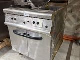 an image of a commercial kitchen with a stove and oven