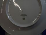 a white plate that has a picture of a bird on it