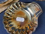 a silver plate with a label on it next to other plates