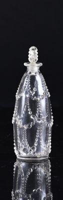 an image of a clear glass bottle on a black surface
