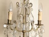 a small crystal chandelier on a wooden table