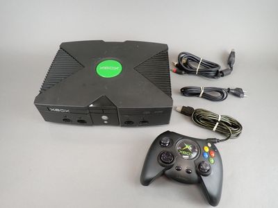 a game console with a game controller and a charger