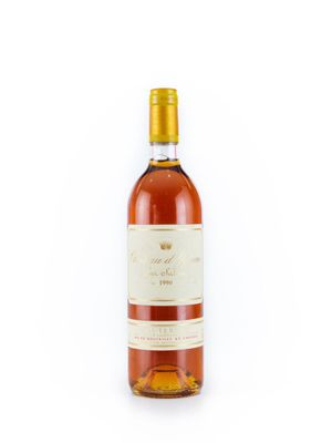 une bouteille de vin posée sur une surface blanche
