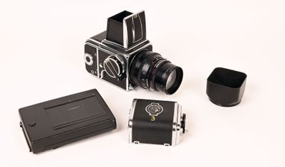 a small camera and a small camera case on a white surface