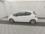 a picture of a white car parked in a garage