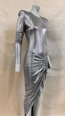 a mannequin mannequin dress with long sleeves and a draped skirt