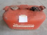 a red gas can sitting on the floor in a warehouse