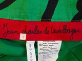 a close up of a label on a green dress