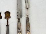 a knife, fork, and spoon sitting on a table