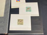several different types of stamps are displayed in a display case