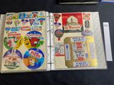 a binder with stickers on it sitting on a table