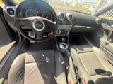 a picture of the interior of a car with a steering wheel and dashboard