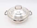 an antique silverplated serving dish with a domed lid