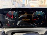 a car dashboard with a speedometer and gauges on it