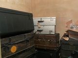 a room with a lot of boxes and a tv in it