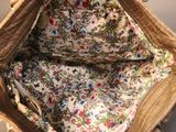 a purse with a floral pattern inside of it