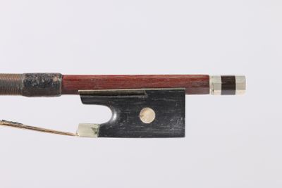 violin bow made of wood and metal with a red handle